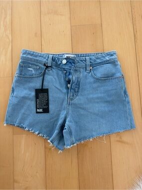 PAIGE Light Wash Frayed Hem Denim Shorts